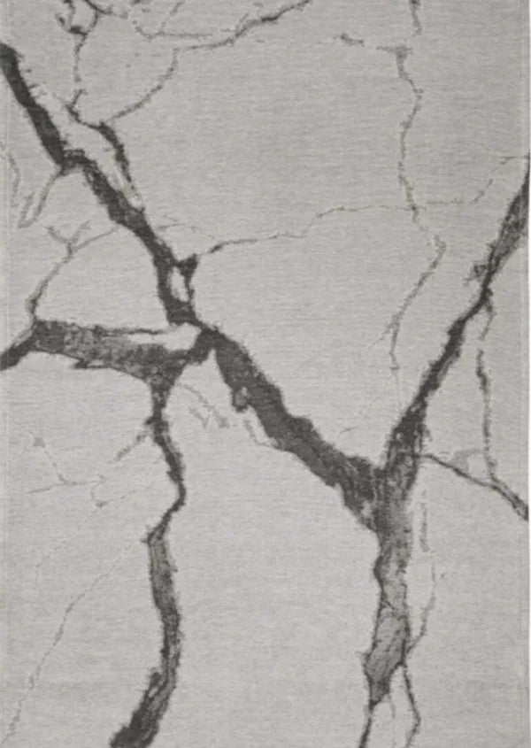 Textured gray surface with black cracks