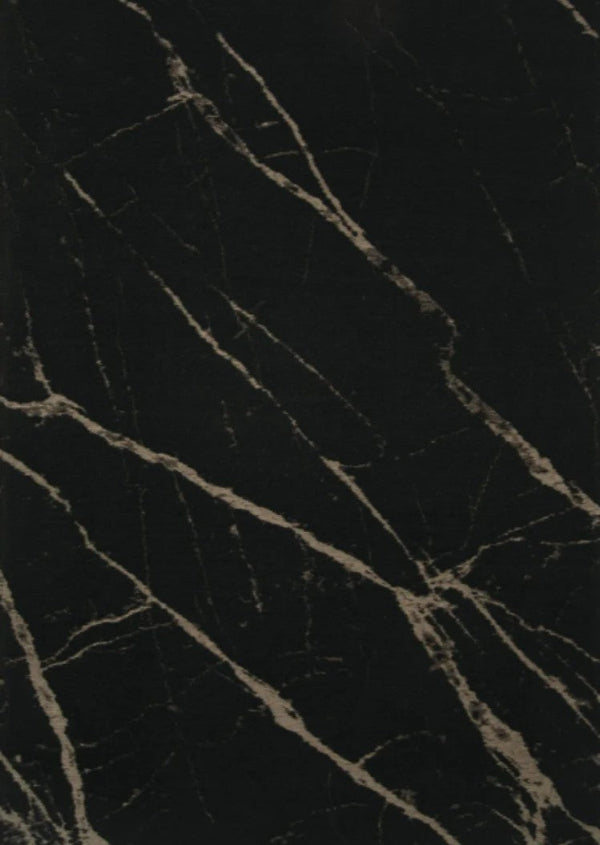 Close-up of a dark textured surface with cracks and patterns