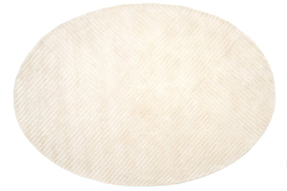 Round beige rug on a white background