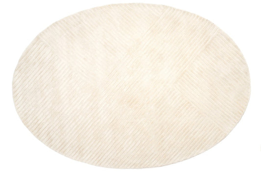 Round beige rug on a white background