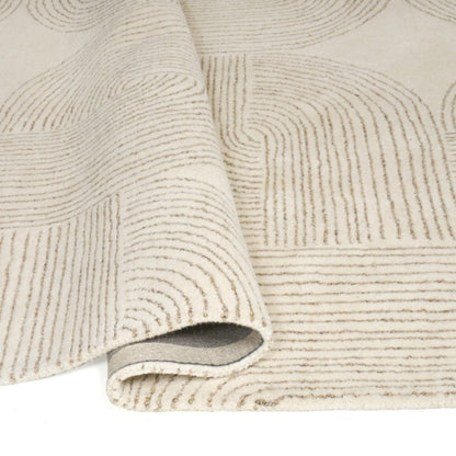 Textured beige rug with a subtle pattern on a white background