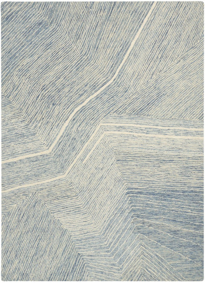 The DKNY Pure Angles Rug Collection with a modern blue geometric design for a stylish home decor