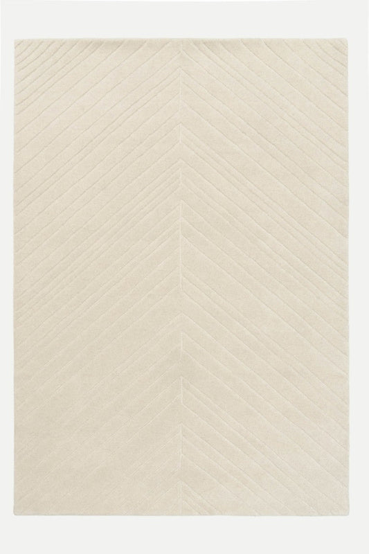 Beige rug with a subtle pattern on a white background