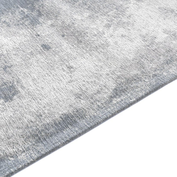 Grey textured rug on a white background
