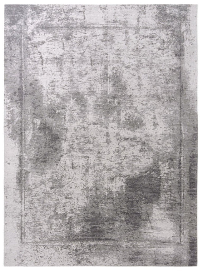 Gray textured area rug with a distressed look