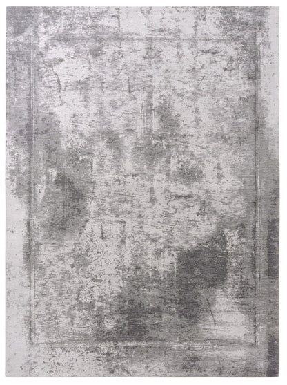 Gray textured area rug with a distressed look