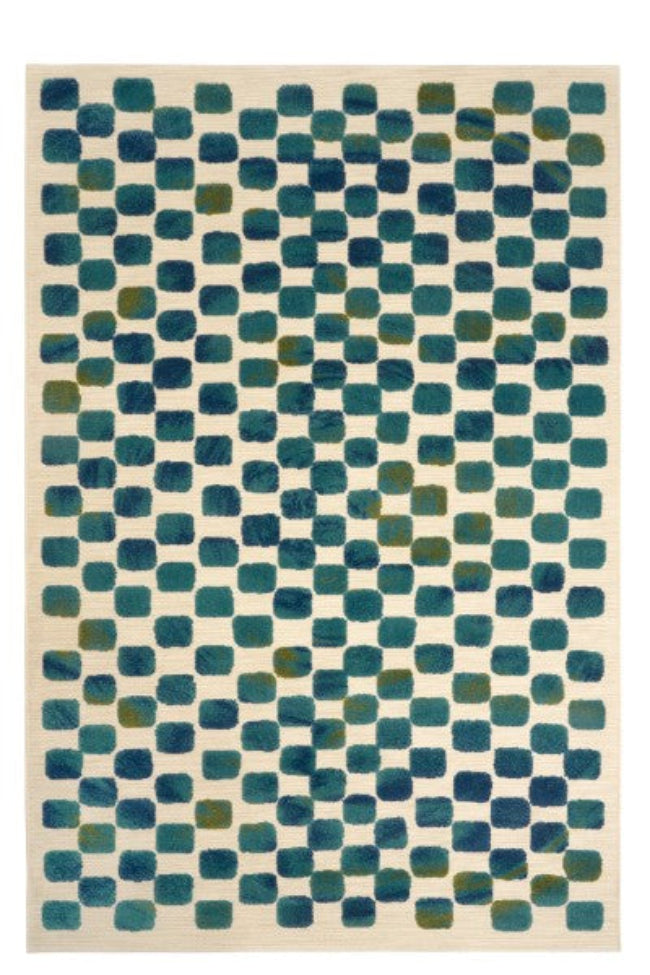 Rug with a geometric pattern of blue and green squares on a beige background