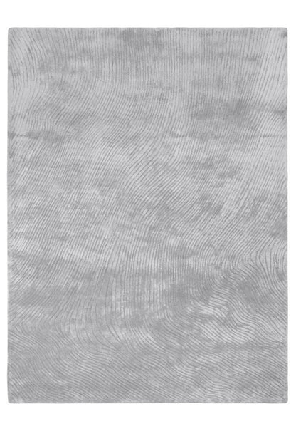 Gray textured rug on a white background