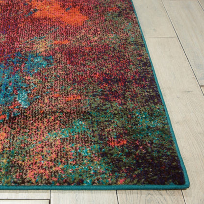 Multicolored abstract patterned rug on a light wooden floor