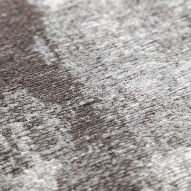 Close-up of a textured grey and white rug