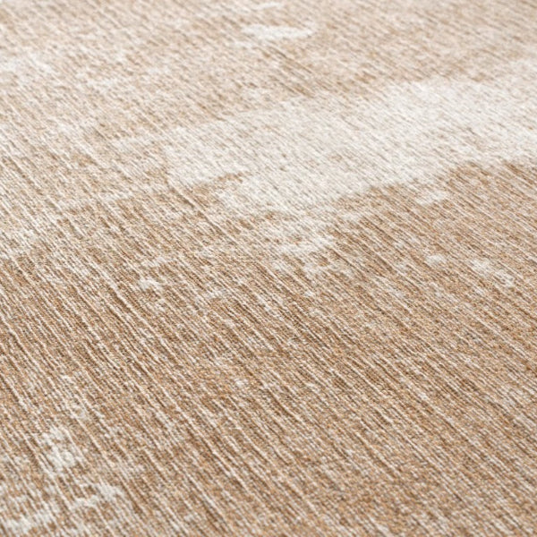 Close-up of a textured beige and white rug