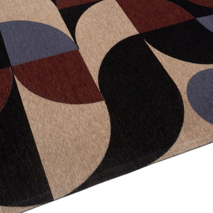 Geometric patterned rug with circular shapes in brown, black, and blue on a beige background