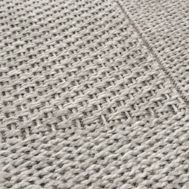 Close-up of a textured gray fabric surface