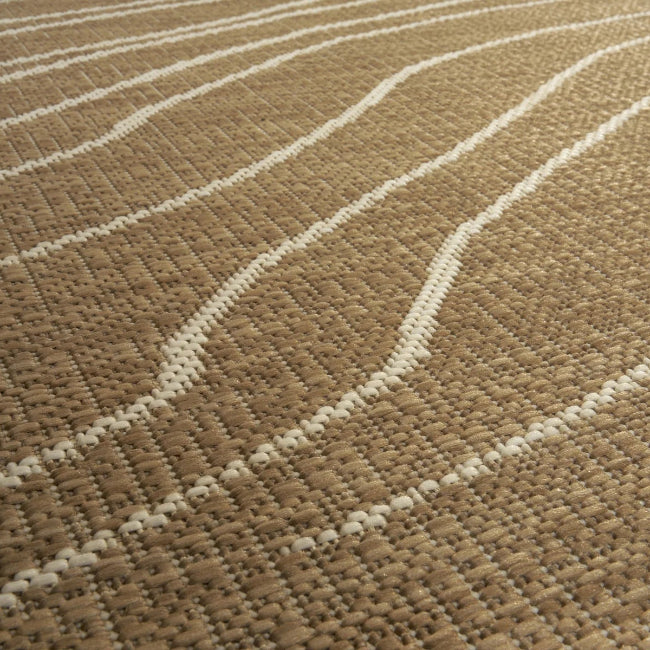 Close-up of a textured brown and beige rug with white lines.