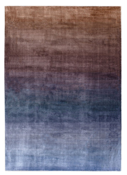 Gradient area rug transitioning from brown to blue on a white background