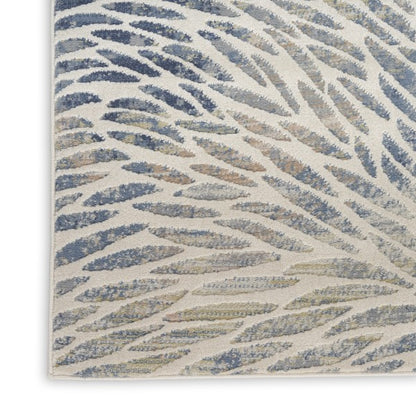 Close-up of a textured blue and beige patterned rug