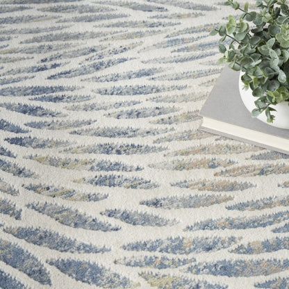 Textured rug with wavy pattern and a plant in the corner
