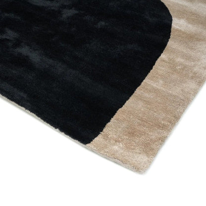 Black and beige rug corner on a white background