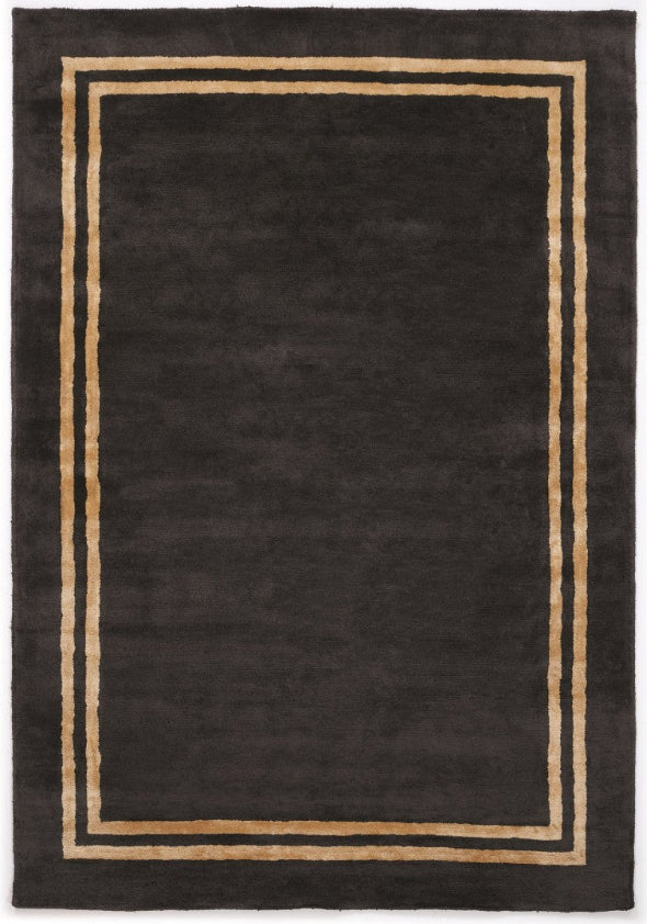 Black rug with a beige border on a white background