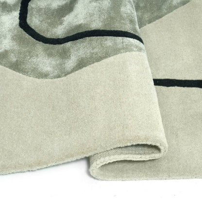 Close-up of a textured fabric with black line design on a neutral background