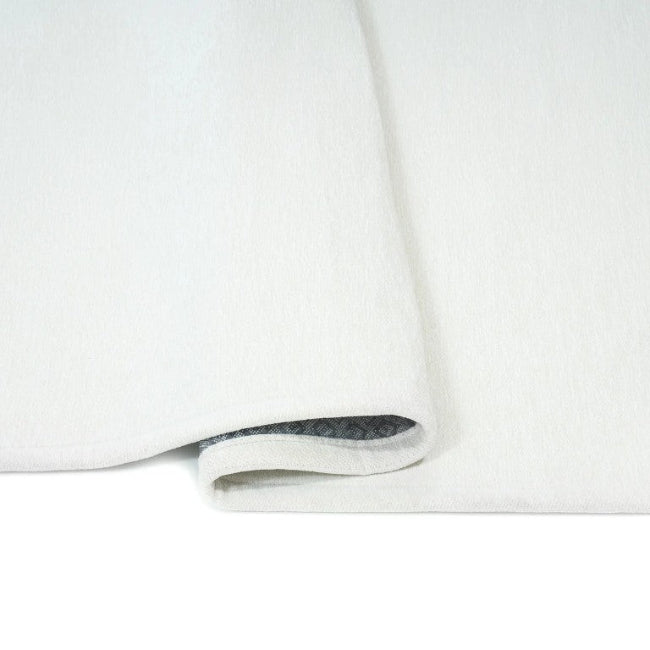 White rug with a subtle pattern on a white background