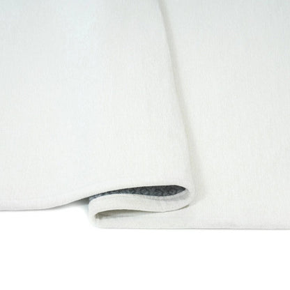 White rug with a subtle pattern on a white background