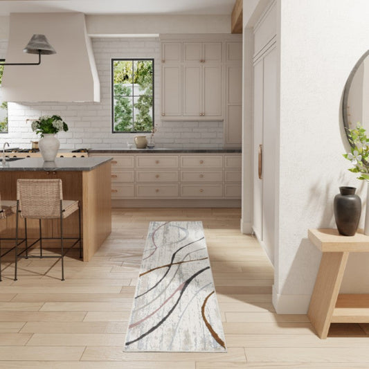 Modern kitchen with a marble-patterned rug on the floor