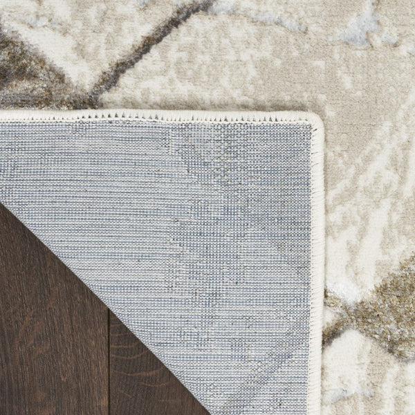 Close-up of a textured rug corner on a wooden floor