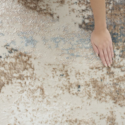 Textured rug with a hand touching it, showcasing its surface pattern.