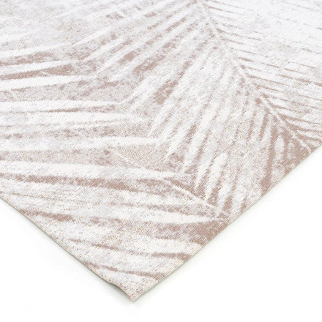 Textured rug with leaf pattern on a white background