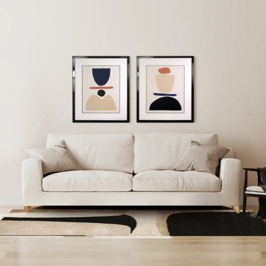 Modern living room with a white sofa, floor lamp, and abstract art on the wall.
