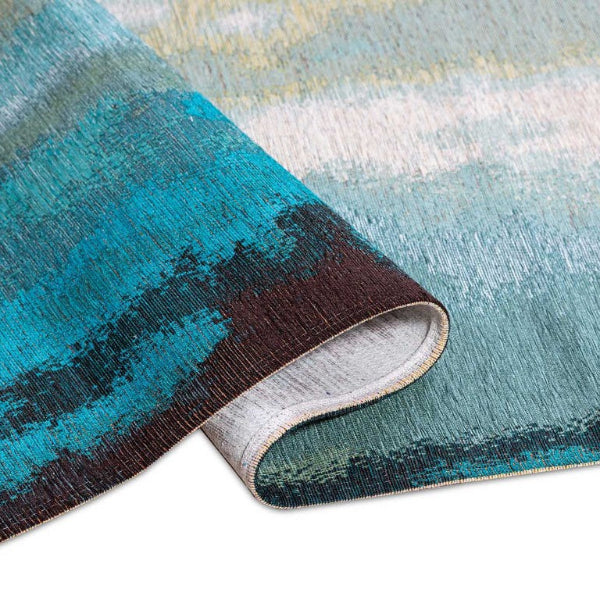 Close-up of a textured rug with blue, gray, and black colors on a white background.