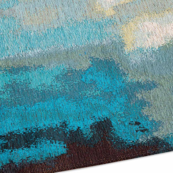 Close-up of a textured rug with blue and brown colors