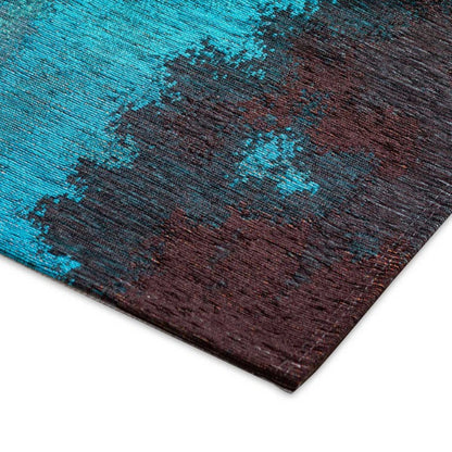 Close-up of a textured rug with blue and brown colors on a white background