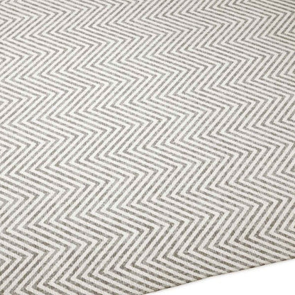 Close-up of a gray and white zigzag patterned rug