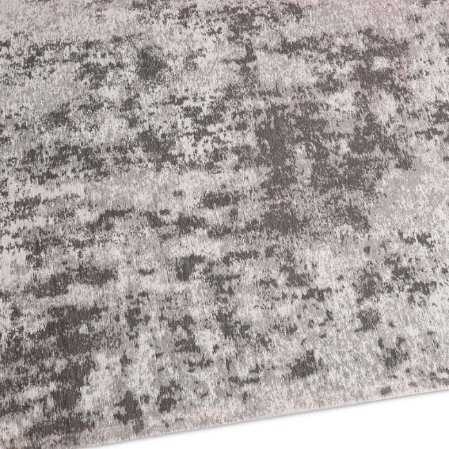 Close-up of a textured gray and black rug