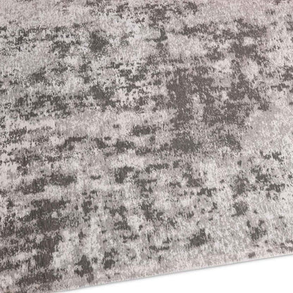 Close-up of a textured gray and black rug