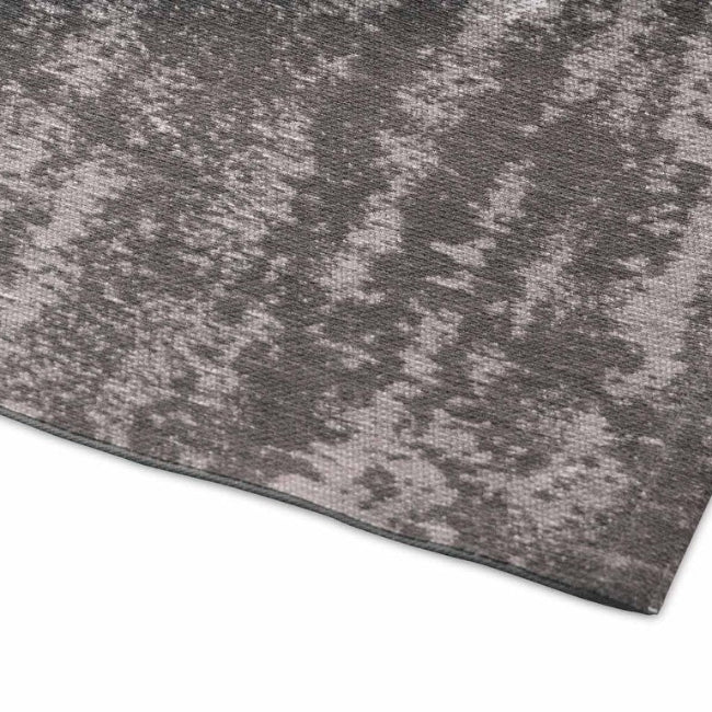 Close-up of a textured gray rug on a white background