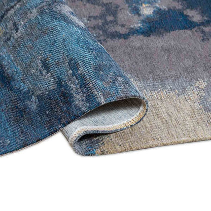 Blue and gray patterned rug on a white background