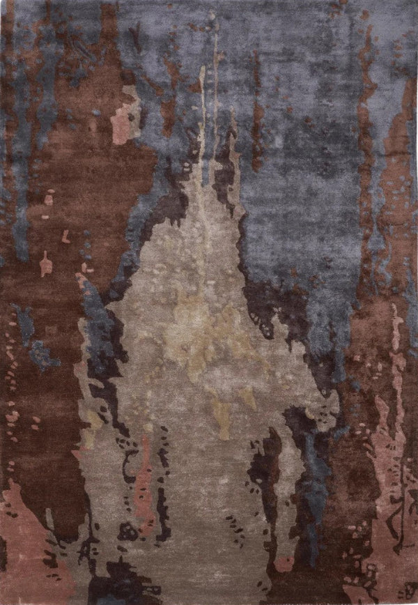 Multicoloured abstract patterned rug with brown, blue, and grey tones.