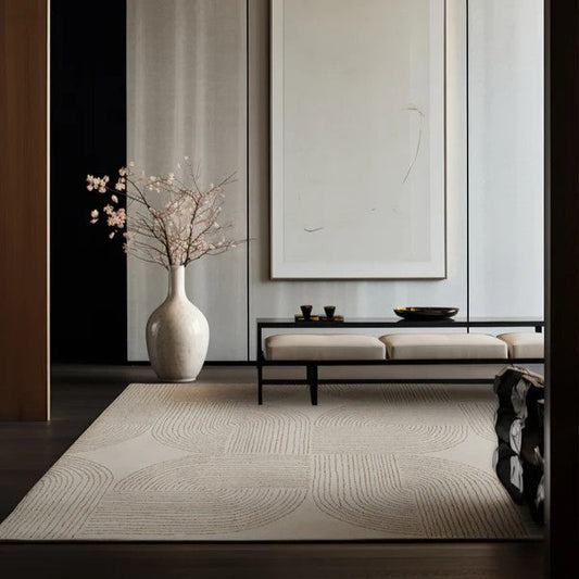 Modern interior with a vase, bench, and abstract painting on a wall.