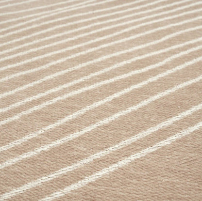 Close-up of beige fabric with white stripes