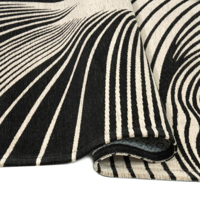 Black and white striped fabric with a textured pattern