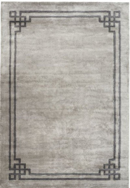 Gray area rug with decorative black border