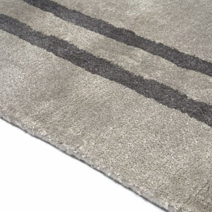 Gray textured mat with black stripes on a white background