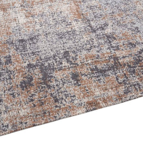 Textured area rug with a pattern of brown, gray, and beige on a white background