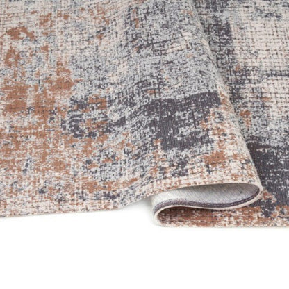 Patterned rug with a textured design on a white background