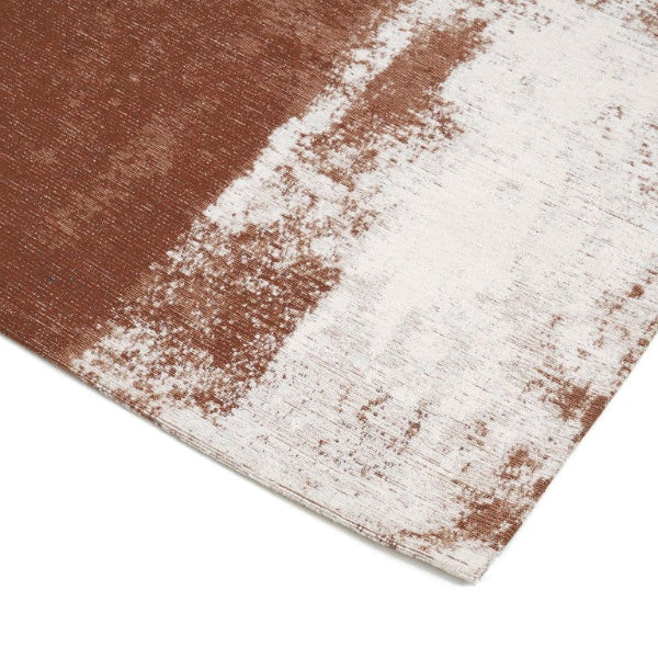 Close-up of a textured rug with brown and white pattern