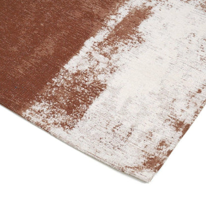 Close-up of a textured rug with brown and white pattern