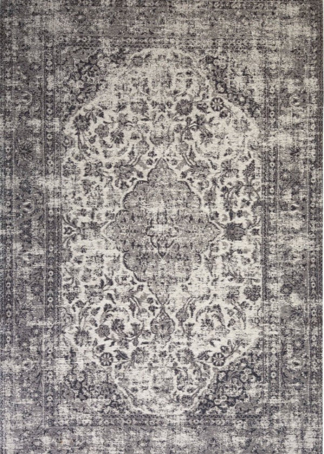 Decorative rug with intricate pattern on a grey background